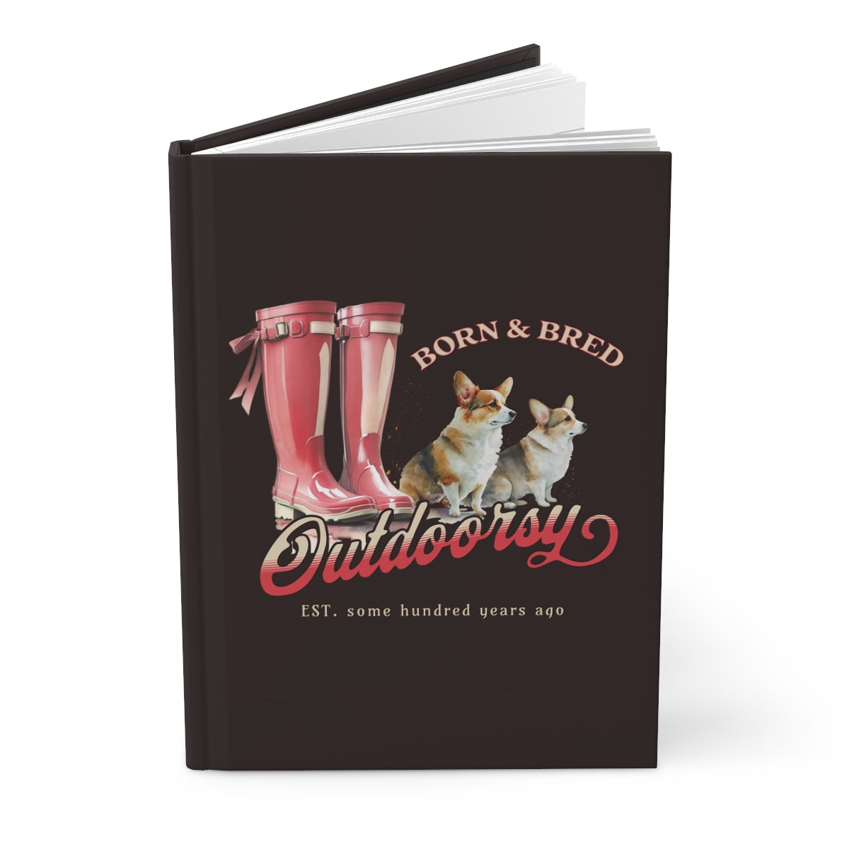 Hardcover brown notebook with red Wellington boots and Corgi dogs design that has texts "born & bred", "outdoorsy" 