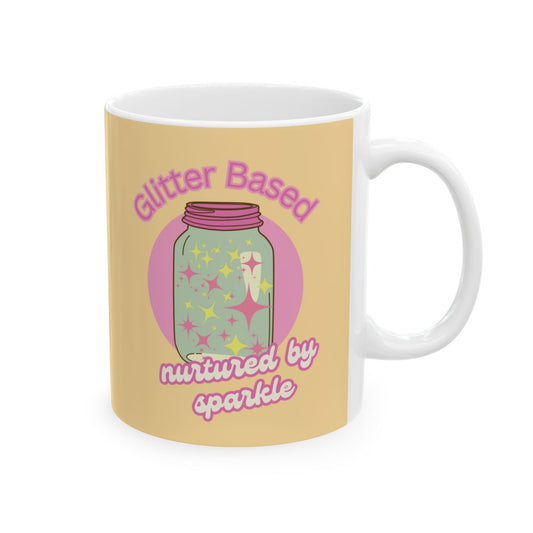 pastel yellow Mug with a design of a pastel colored jar filled with sparkle and text "glitter based, nurtured by sparkle" in pink retro aesthetic letters