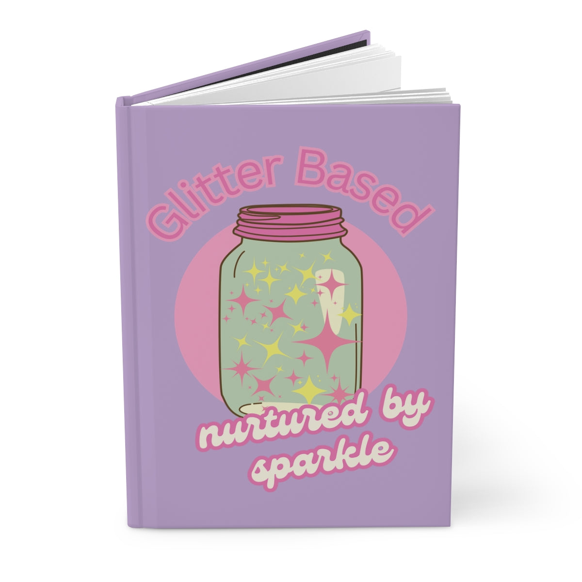 Open pastel purple color hardcover journal with featuring an illustration of a  retro style mason jar with pink lid filled with pastel colored glitter and text "glitter based nurtured by sparkle" written in pink retro aesthetic letters