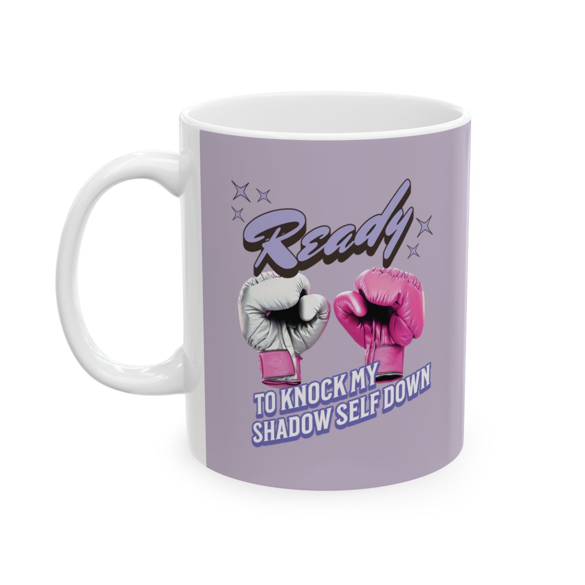 Mug with pink boxing gloves and  text "ready" "to knock my shadow self down" written in retro style letters on a light purple background