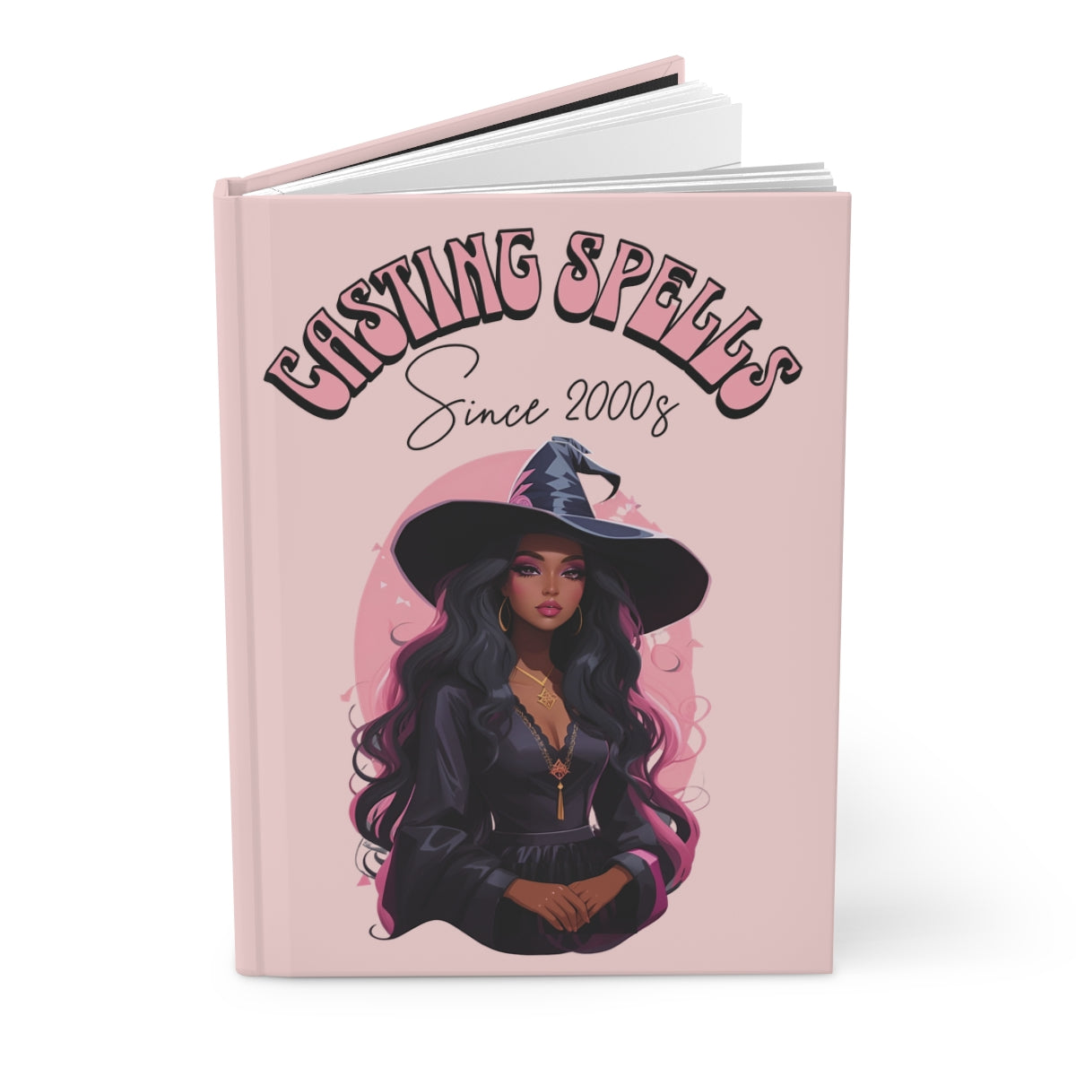 Pastel pink hardcover journal with a beautiful witch illustration and text 'Casting Spells Since 2000s' written in pink retro groovy letters 