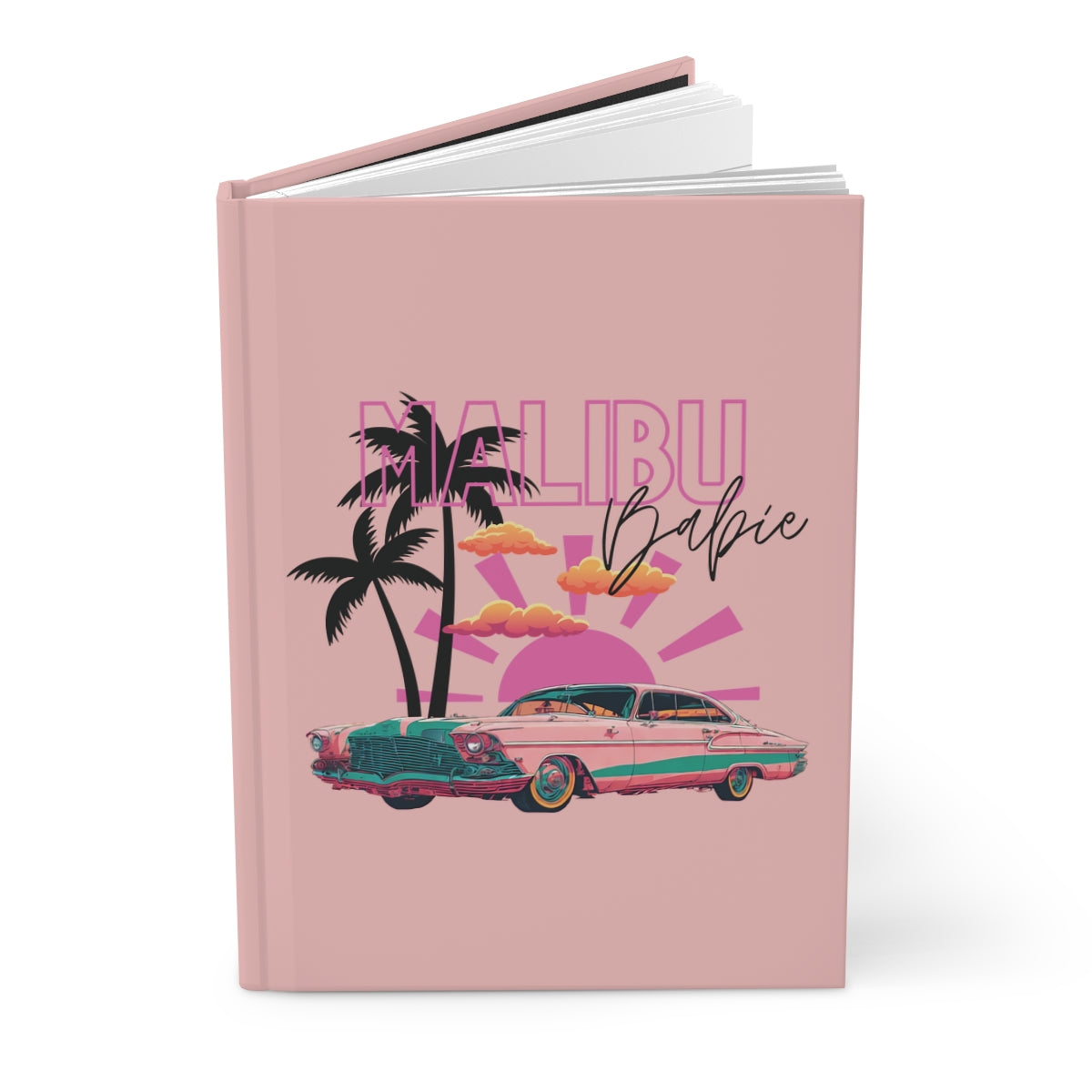Hardcover Notebook with a baby pink cover featuring palm trees, a pink vintage car, pastel orange clouds, a pink sun and retro aesthetic 'Malibu Babie' text on a pastel pink background