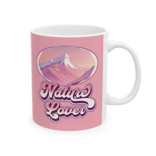 Pastel pink mug with mountain graphic in pink tones and Groovy style pastel colored 'Nature Lover' text 