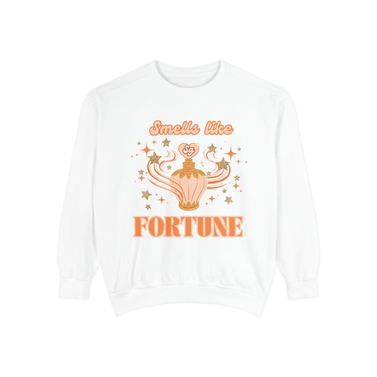 White sweatshirt with orange perfume bottle graphic with stars and text 'Smells like Fortune' on a white background