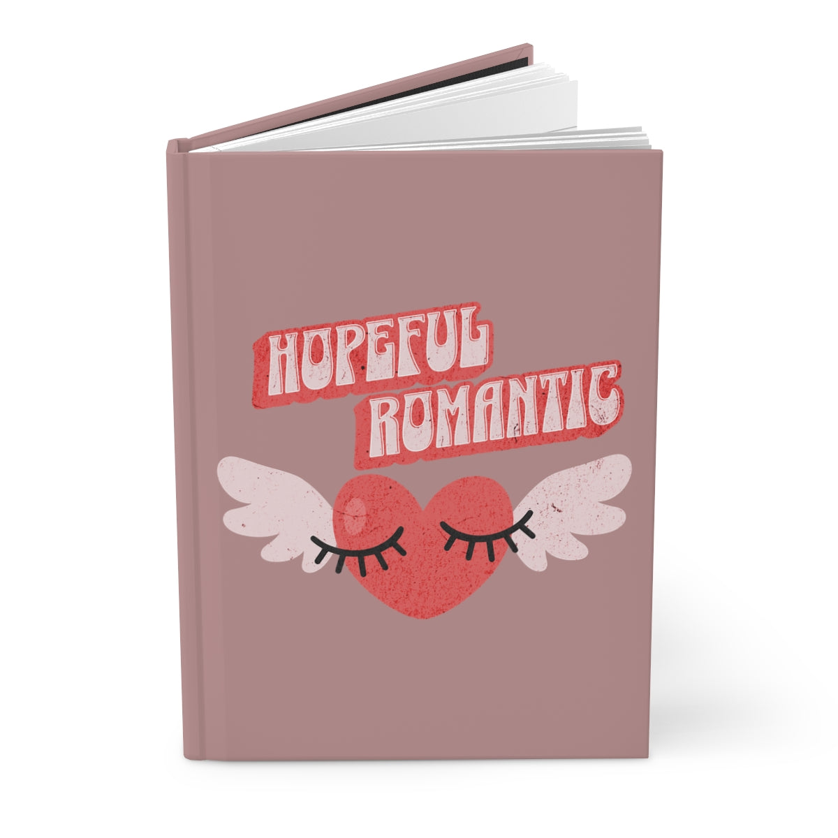 Notebook with 'Hopeful Romantic' text written in red vintage style letters and retro aesthetic heart with wings and flirty eyelashes design 
