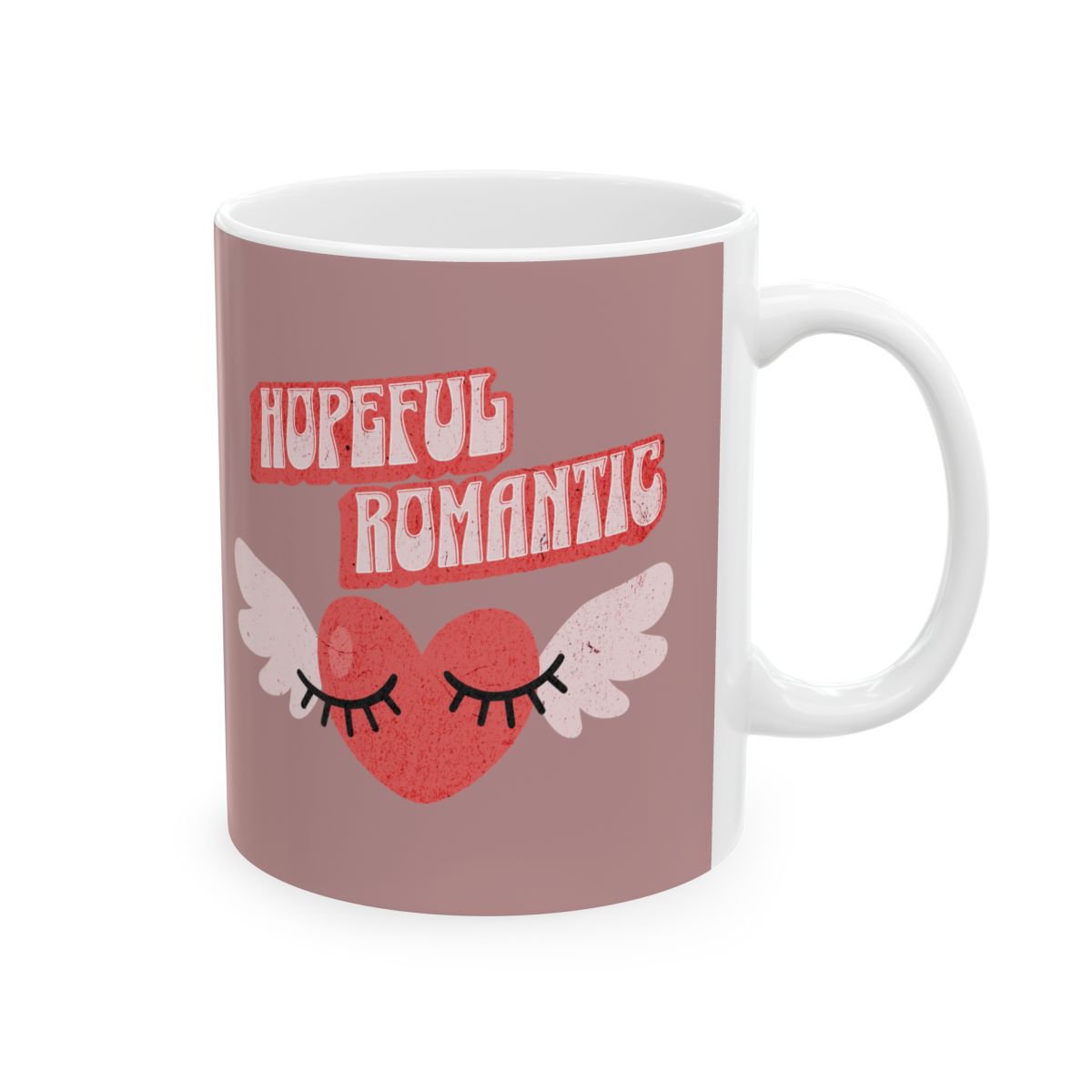 Mug with 'Hopeful Romantic' text written in retro style letters and a heart with wings design 