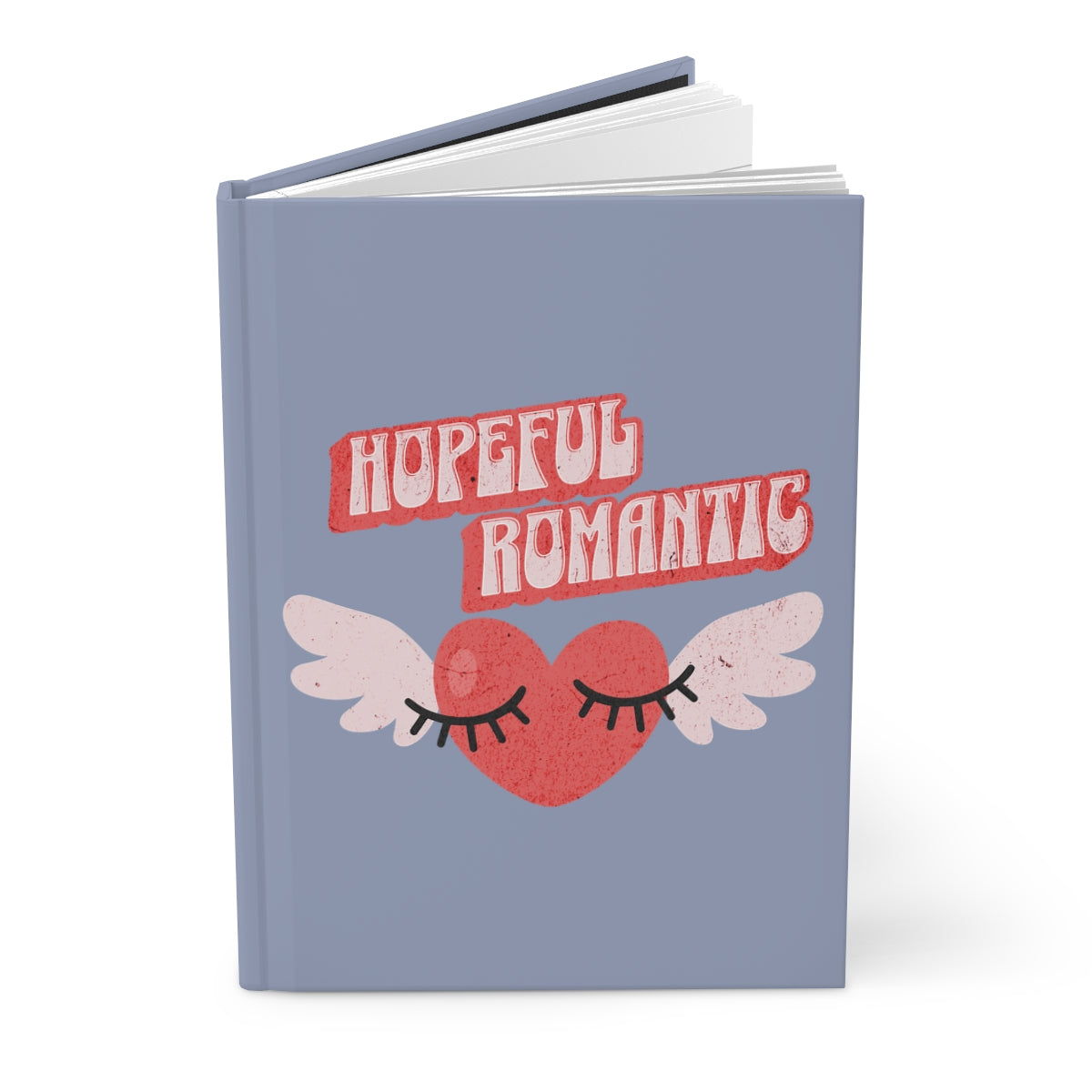 Notebook with a retro style red heart with wings design and 'Hopeful Romantic' text written in retro style letters, on a light blue jean colored background