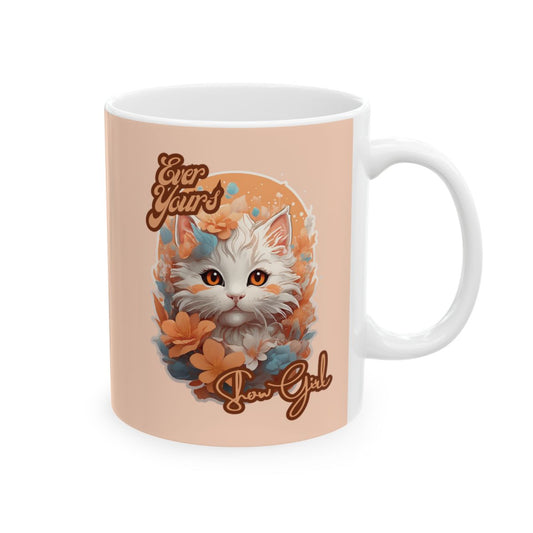 Mug with a kawaii style kitten illustration and text that says "ever yours" "show girl" on a peach background