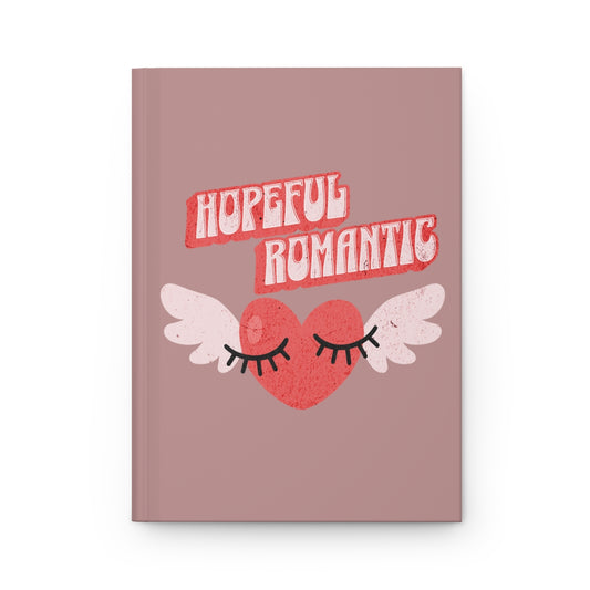 Notebook with 'Hopeful Romantic' text written in red vintage style letters and retro aesthetic heart with wings and flirty eyelashes design 
