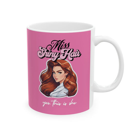 Pink mug with a 90s style illustration of a woman with glamorous hair and retro style text "miss shiny hair"